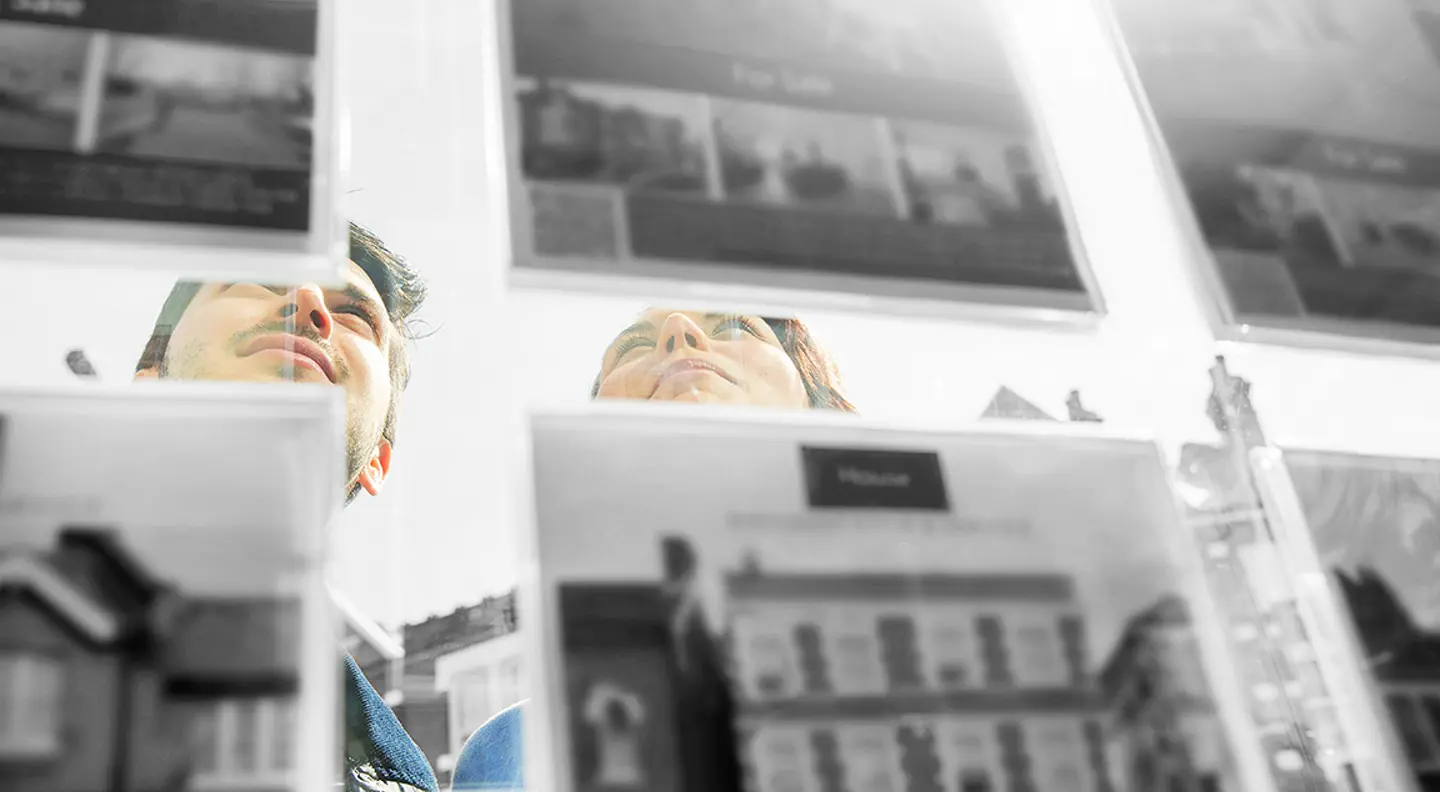 People looking at property listings