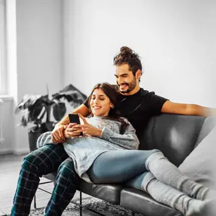 Couple on the sofa in new home