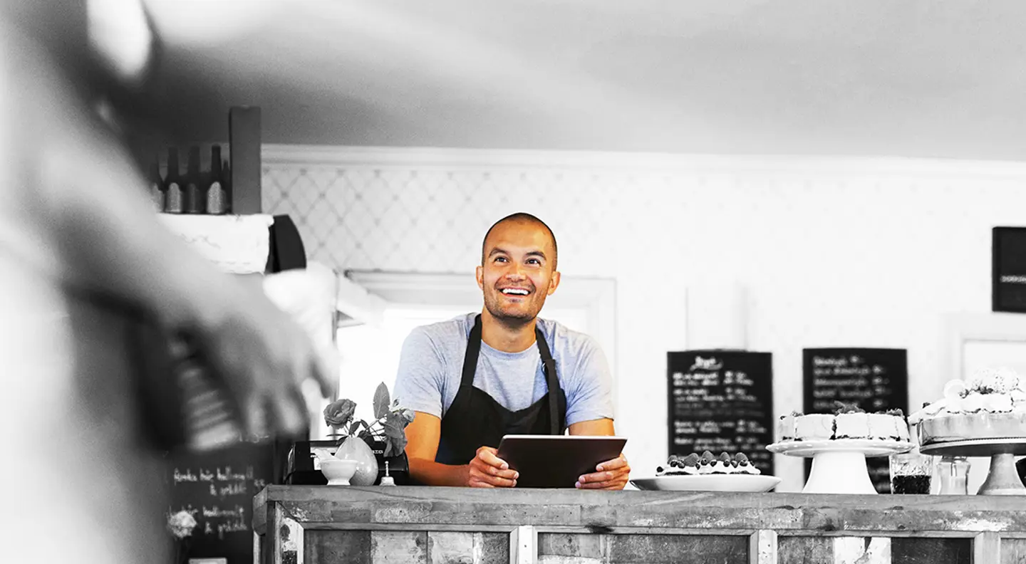 Smiling café owner