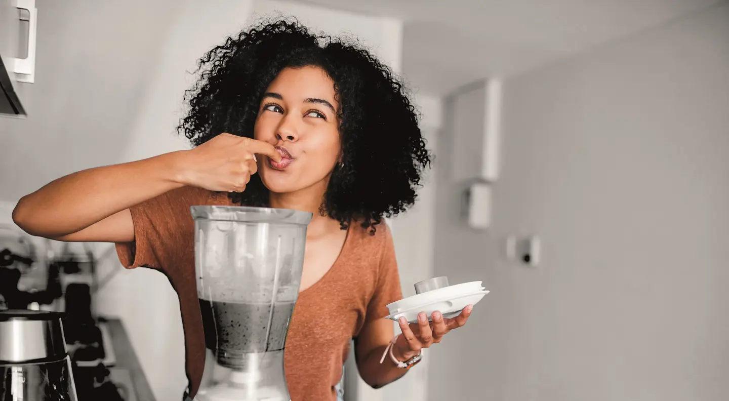 Person enjoying a freshly made smoothie